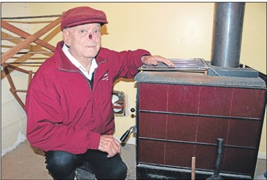 Burning need: Ted Bastable relies on his woodburner to heat his home and water. 